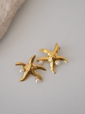 84f1561c6b9cba06e3f2856436de9f5a.jpg İnci Detaylı Deniz Yıldızı Model Çelik Küpe