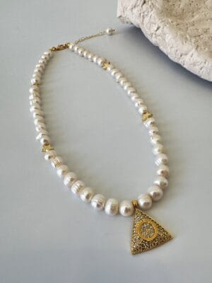 b10c588cd4e48af5848578e37e0393a5.jpg Zirkon Taş Detaylı Yıldız Model İnci Kolye